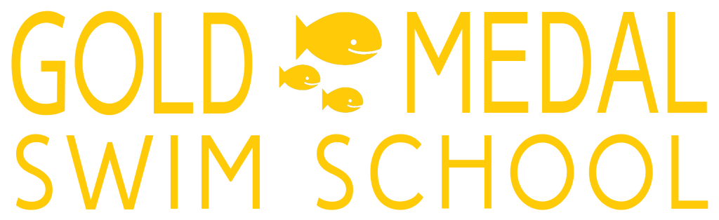 Gold Medal Swim School logo with yellow text on a transparent background. Three stylized yellow fish form the "O" in "GOLD" and "MEDAL." The words "SWIM SCHOOL" are displayed below.